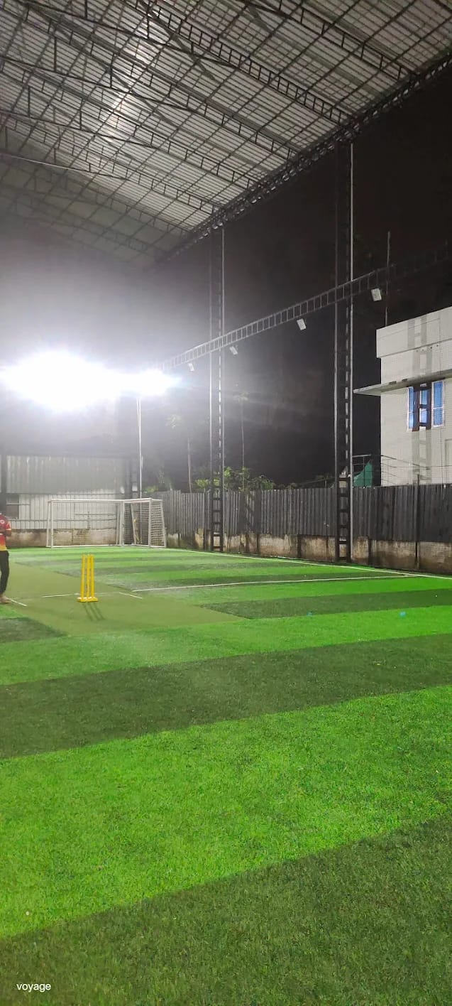 Indoor cricket facility with artificial turf